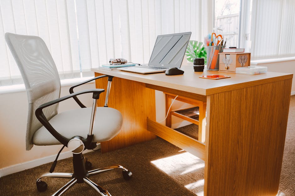 A bright and modern home office setup with a laptop on a desk.